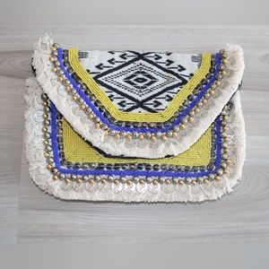 Boho Clutch/crossbody bag . It has chain in it to use it as a crossbody bag